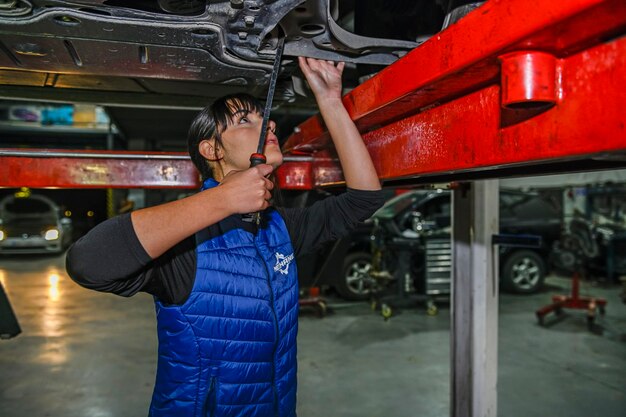 young-female-mechanic-working-repair-car-engine